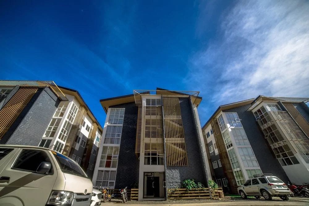 The building from outside, with parking in front